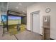 Indoor golf simulator room featuring a state-of-the-art setup for practice and recreation at 16807 Barnwood Pl, Bradenton, FL 34211