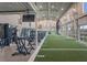 Spacious gym with state-of-the-art exercise equipment and large windows offering views of surrounding greenery at 16807 Barnwood Pl, Bradenton, FL 34211