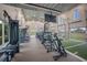 Bright gym with various machines, turf area, and large windows providing ample natural light and scenic views at 16807 Barnwood Pl, Bradenton, FL 34211