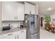 The kitchen has granite countertops, stainless steel appliances, and plenty of storage at 16807 Barnwood Pl, Bradenton, FL 34211