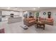 Open living area with bright white kitchen and stainless appliances, ideal for entertaining at 16807 Barnwood Pl, Bradenton, FL 34211