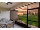 Relaxing screened-in patio overlooking a manicured lawn and a scenic view at 16807 Barnwood Pl, Bradenton, FL 34211