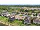 Overhead view of residences with water views, solar panels, and community landscaping at 17018 Blue Ridge Pl, Bradenton, FL 34211