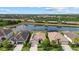Scenic aerial view showcasing the backyard lake of homes with tile roofs and lush landscaping at 17018 Blue Ridge Pl, Bradenton, FL 34211