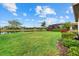 Expansive backyard featuring well-maintained lawn and water view at 17018 Blue Ridge Pl, Bradenton, FL 34211