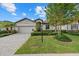 Charming single-Gathering home with a well-manicured lawn, elegant landscaping, and a two-car garage at 17018 Blue Ridge Pl, Bradenton, FL 34211