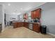 An open kitchen with wood cabinets, granite countertops, and stainless steel appliances at 17018 Blue Ridge Pl, Bradenton, FL 34211