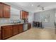 Modern kitchen with stainless steel appliances and dining area near window at 17018 Blue Ridge Pl, Bradenton, FL 34211