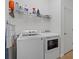 This functional laundry room offers plenty of space for side-by-side washer and dryer at 17018 Blue Ridge Pl, Bradenton, FL 34211