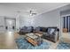 Bright and inviting living room featuring comfortable seating, tile floors, and modern decor at 17018 Blue Ridge Pl, Bradenton, FL 34211