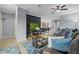Open-concept living room featuring tile floors, neutral walls, and a stylish entertainment area at 17018 Blue Ridge Pl, Bradenton, FL 34211