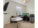 This office has a modern ceiling fan and a large desk for all your remote work needs at 17018 Blue Ridge Pl, Bradenton, FL 34211