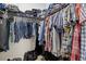 Well-organized walk-in closet with shelves, hanging rods, and clothing at 17018 Blue Ridge Pl, Bradenton, FL 34211