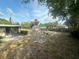 Spacious fenced backyard with mature trees and a small shed at 1905 Yale Ave, Bradenton, FL 34207