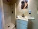 Bathroom showcasing a walk-in shower and vanity sink with modern black faucet at 1905 Yale Ave, Bradenton, FL 34207