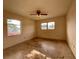 Simple bedroom with two windows and ceiling fan at 1905 Yale Ave, Bradenton, FL 34207