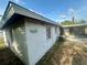 A view of the side of the home and enclosed porch area at 1905 Yale Ave, Bradenton, FL 34207