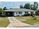 Cozy single-story home with a covered carport and a concrete driveway at 1905 Yale Ave, Bradenton, FL 34207
