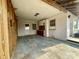 Spacious garage featuring storage cabinets, two windows, and access to the back door at 1905 Yale Ave, Bradenton, FL 34207