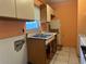 Basic kitchen area with a stainless steel sink, and tile backsplash at 1905 Yale Ave, Bradenton, FL 34207
