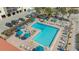 Aerial view of the community pool, spa, and lounge area with beach access at 2045 Gulf Of Mexico Dr # M1-302, Longboat Key, FL 34228