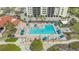 A gorgeous aerial view of the community pool, spa, and lounging area at 2045 Gulf Of Mexico Dr # M1-302, Longboat Key, FL 34228