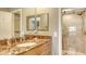 Updated bathroom features a stylish vanity, a tiled shower with grab bars, and modern fixtures at 2045 Gulf Of Mexico Dr # M1-302, Longboat Key, FL 34228