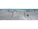 Expansive beach with lounge chairs, sun umbrellas, and beachgoers enjoying the sun and surf at 2045 Gulf Of Mexico Dr # M1-302, Longboat Key, FL 34228