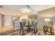 Cozy dining area next to the kitchen features a glass table and seating for four at 2045 Gulf Of Mexico Dr # M1-302, Longboat Key, FL 34228