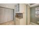 Well-maintained hallway with storage closets and neutral decor at 2045 Gulf Of Mexico Dr # M1-302, Longboat Key, FL 34228