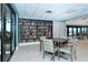 Reading room featuring a table, chairs, and a large bookshelf filled with books for resident use at 2045 Gulf Of Mexico Dr # M1-302, Longboat Key, FL 34228