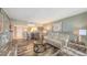 Inviting living room featuring comfortable seating and an open layout leading to the dining area at 2045 Gulf Of Mexico Dr # M1-302, Longboat Key, FL 34228