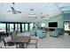 A community clubhouse lounge featuring comfortable seating, ocean views, and a large TV at 2045 Gulf Of Mexico Dr # M1-302, Longboat Key, FL 34228