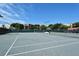 A fenced community tennis court provides a venue for exercise and socializing at 2045 Gulf Of Mexico Dr # M1-302, Longboat Key, FL 34228