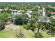 Aerial view of homes in a lush community with mature trees and well-maintained landscaping at 2067 Tocobaga Ln, Nokomis, FL 34275