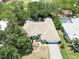 Aerial view of a home featuring a pool and lush landscaping, backing onto a golf course at 2067 Tocobaga Ln, Nokomis, FL 34275