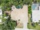 Overhead view showcasing a home with a private pool, mature landscaping, and proximity to a golf course at 2067 Tocobaga Ln, Nokomis, FL 34275