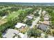 Scenic aerial view of homes near a golf course with mature trees and manicured landscaping at 2067 Tocobaga Ln, Nokomis, FL 34275