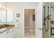 Bright bathroom with granite countertop vanity, modern fixtures, and glass shower at 2067 Tocobaga Ln, Nokomis, FL 34275