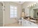 Bathroom featuring tiled floors, granite counters, and a glass-enclosed shower at 2067 Tocobaga Ln, Nokomis, FL 34275