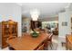 A dining room featuring a light fixture and view to living area and pool at 2067 Tocobaga Ln, Nokomis, FL 34275