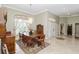 Elegant dining room with a modern chandelier, and neutral walls at 2067 Tocobaga Ln, Nokomis, FL 34275