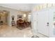 Elegant entrance foyer with high ceilings, tile flooring, chandelier, and large windows at 2067 Tocobaga Ln, Nokomis, FL 34275