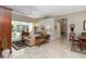 Bright living room with tile floors, neutral walls, and view of the pool at 2067 Tocobaga Ln, Nokomis, FL 34275