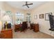 Bright office with a desk, comfortable leather chair, and abundant natural light at 2067 Tocobaga Ln, Nokomis, FL 34275