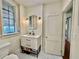 Bright bathroom features a modern vanity, updated lighting, and mosaic tile floors at 210 N 17Th W St # 15, Bradenton, FL 34205