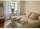 Bright bedroom features a large window and a comfortable king size bed at 210 N 17Th W St # 15, Bradenton, FL 34205