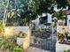 The entrance features a wrought iron gate leading to a garden oasis at 210 N 17Th W St # 15, Bradenton, FL 34205