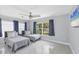 Bright bedroom with two beds, lots of natural light, and a ceiling fan at 2100 Oyster Creek Dr, Englewood, FL 34224