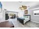 A versatile bedroom with a bed and desk area bathed in natural light, offering flexible living at 2100 Oyster Creek Dr, Englewood, FL 34224
